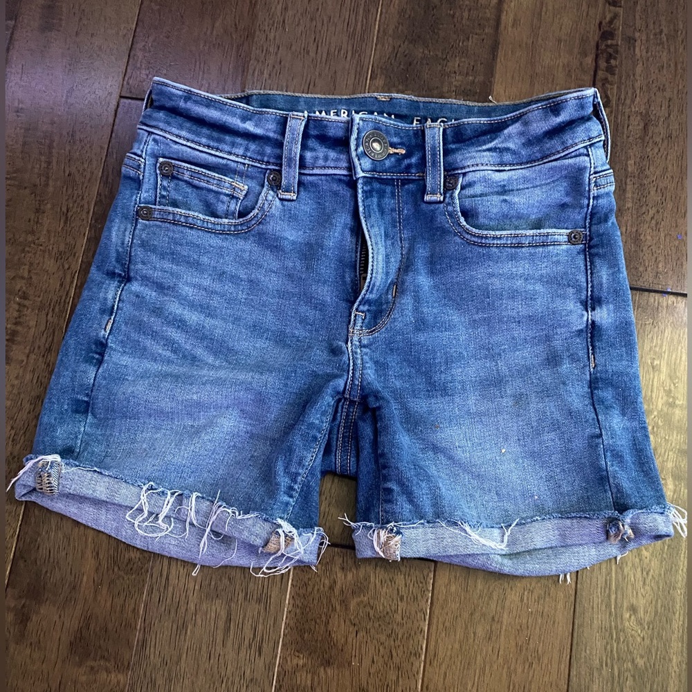 Jeans shorts ripped mid-length